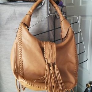 Big buddha tan purse with tassels
